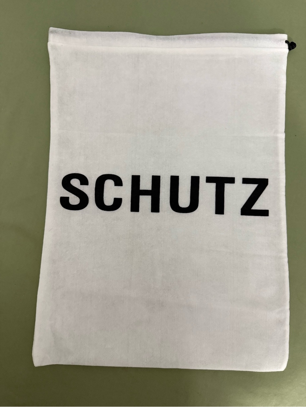 SCHUTZ White and Black Logo Canvas Wall Pouch Length: 15” • Width: 11”
